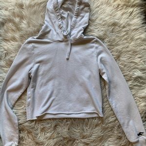 A white cropped Hollister hoodie